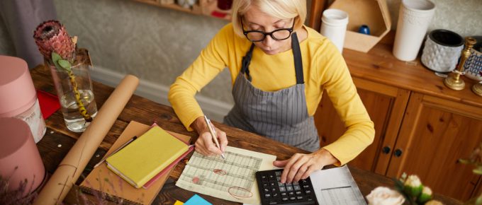Small business owner does her taxes at her flower shop